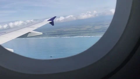View of the coastline from the window of an airplane Stock Footage 234081016