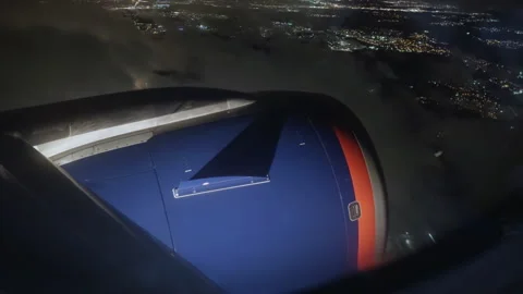 View from cockpit of an airplane flying through thick clouds with view of night Stock Footage 291188426