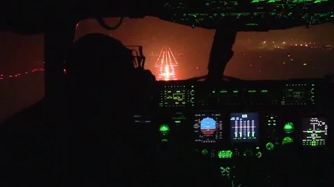 View from cockpit of C-17 Globemaster approaching runway and landing at night Stock-Footage 84490458
