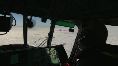 View from the cockpit of a Mi-8 helicopter flying over the frozen sea. Stock Footage 257552286