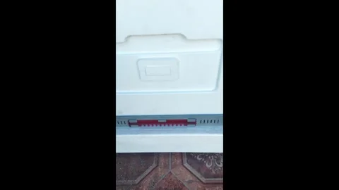 View of a cold storage unit with signs of water leakage in a kitchen setting Stock Footage 327180803