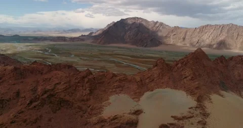 View of colored mountains and river valley in Mongolia Stock Footage 194427199