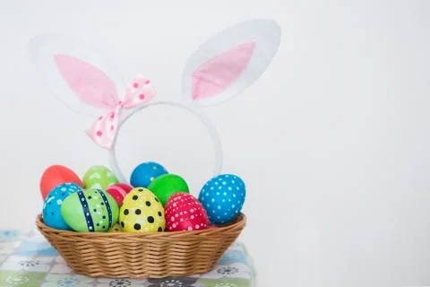View of colorful Easter eggs in a basket. Stock Photos