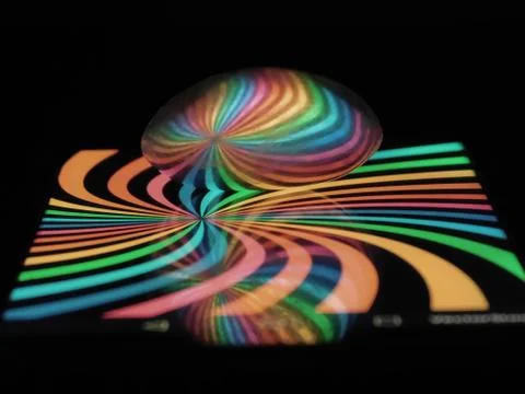 View of colorful light reflection on a spoon Stock Photos