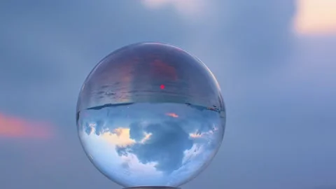 View of colorful sky upside down in crystal ball. Stock Footage 235151083