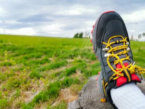 View of colorful trekking boots in nature Stock Photos