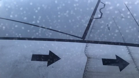 View of commercial plane wing close up details pan to horizon Stock Footage 98635485