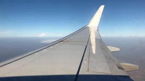 View from commercial plane wing over land Stock Footage 98635448