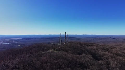 View of communication towers on a mountain during bright day Video stock 335143987