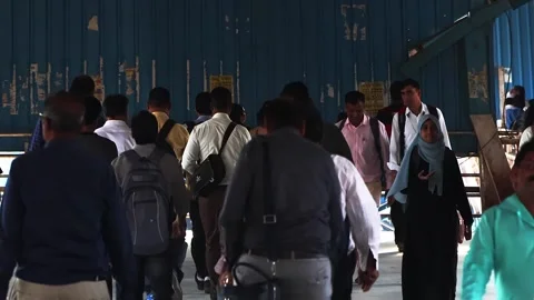 View of commuters walking at crowded Bandra railway skywalk. Rush hour time. Stock Footage 274499138