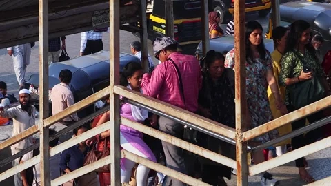 View of commuters walking at crowded Bandra railway skywalk. Rush hour time. Stock Footage 274499454