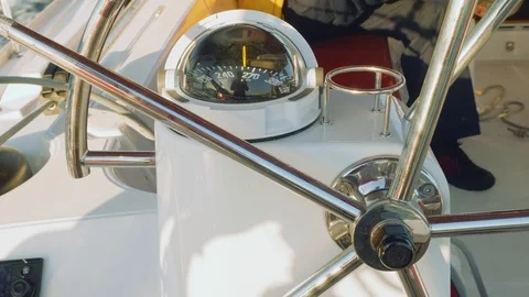 View of compass and steer wheel of yacht cockpit Video stock 86083817