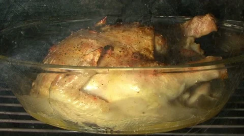 View the complete roast chicken in the oven. Time lapse Stock Footage 43833354