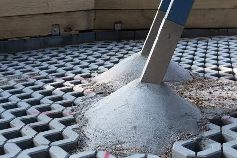 View of the concrete structural elements on the cobblestones at a construction Stock Photos