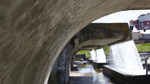 View of concrete wall from under the waterfall. Sunlight spot.  Spring, the Gene Stock Footage 85282984