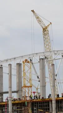 View of the construction of large stadium in the city. Vertical shot. Stock Photos