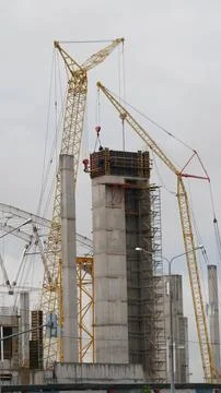 View of the construction of large stadium in the city. Vertical shot. Stock Photos