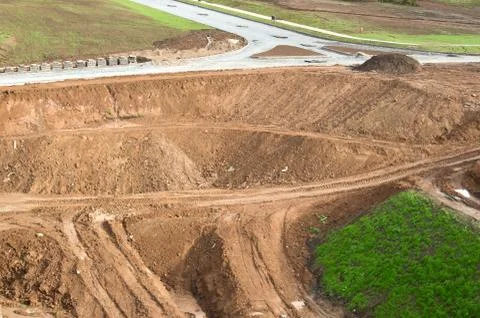 View to  the construction of the road type. mounds of ground, clay, stones. Stock Photos