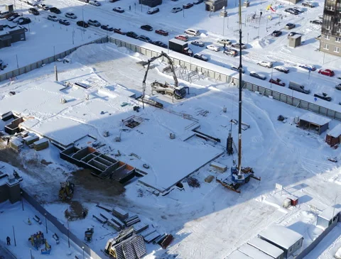 View of the construction site of a building in the winter Stock Footage 149751201