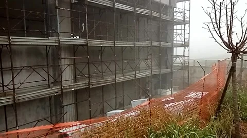 View of a construction site with external scaffolding assembled Video stock 328355882