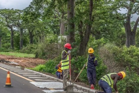View of construction workers working on roadside roads Stock Photos