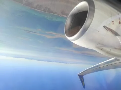 A view of continent and sea from the airplane Stock Photos