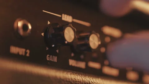 View of the control panel on a guitar amplifier. Tumblers, knobs and buttons Stock Footage 100360546