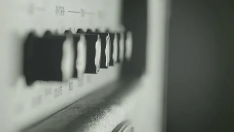 View of the control panel on a guitar amplifier. Tumblers, knobs and buttons Stock Footage 100360640