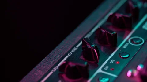 View of the control panel on a guitar amplifier. Tumblers, knobs and buttons Stockbeeldmateriaal 105096055