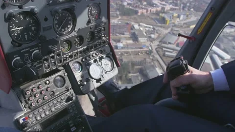 View at control system, pilot hold lever of helicopter. Camera inside. Above Stock Footage 151381122