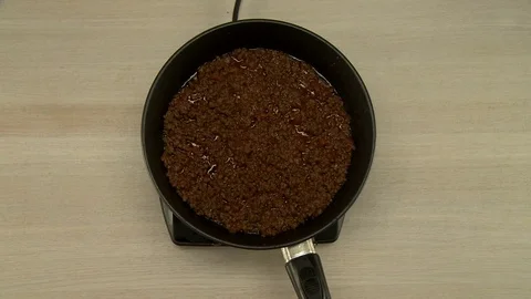 View on cook stirs beans and meat during cooking Stock Footage 73564097