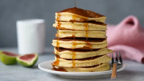 View of Cooked pancakes with syrup. Pancake with sauce. 스톡 동영상 336588999