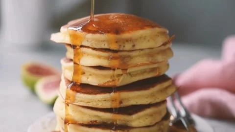 View of Cooked pancakes with syrup. Pancake with sauce. Video stock 336589045