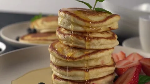 View of Cooked pancakes with syrup. Pancake with sauce. Видео 336589067
