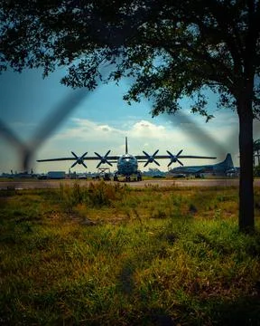 View of cool cargo plane through a fence for aviation 写真素材