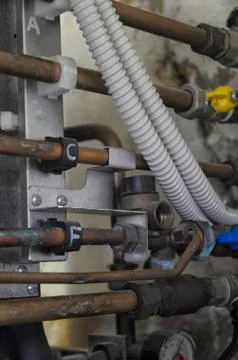 View of copper tubes and knobs within a boiler 스톡 사진