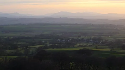 A View of the Countryside in England in the Evening With Distant Mountains Stock Footage 246936981
