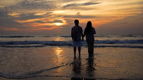 View of a couple holding hands at sunset on the beach, Bangladesh. Video stock 335022611