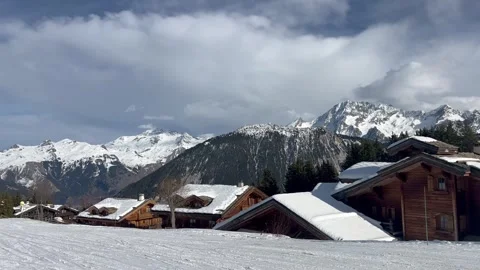 View of Courchevel ski resort with chalets on the slopes by winter Stock Footage 334404003