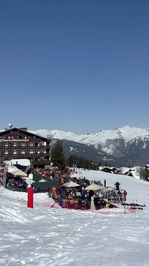 View of Courchevel ski resort slopes with chalet in the background Stock Footage 334430688