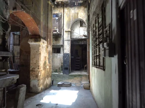 View to a courtyard of old dilapidated poor houses in the slums at Havana Stock Footage 71038073
