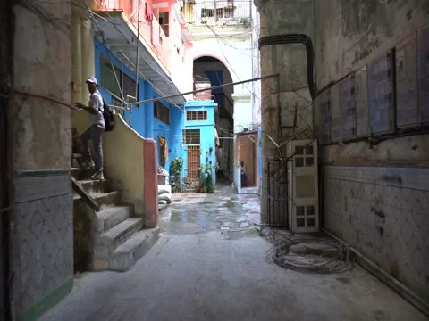 View to a courtyard of old shabby poor houses in the slums at Havana Stock Footage 71038396