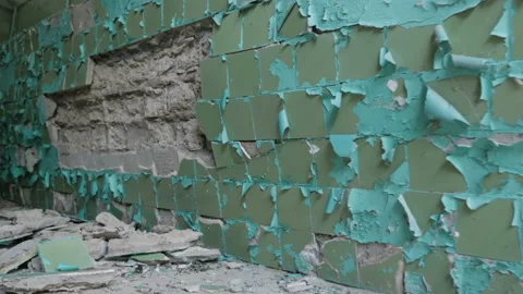 View of cracked ceramic tiles falling off from the wall, closeup Stock Footage 90665724