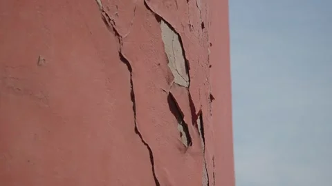 View of cracked paint on wall under blue sky Stock Footage 319053982