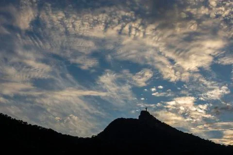 View to Cristo Redentor during sunset with beautiful orange clouds Stock Photos