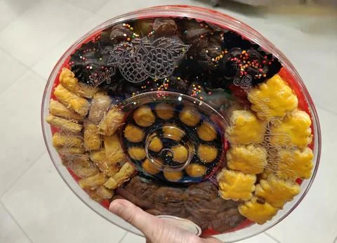 View of cropped hand holding assorted biscuit Stock Photos