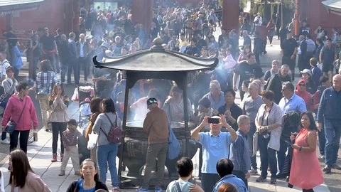 View of the crowd inside the Senso-ji in Tokyo Japan Stock Footage 129280916