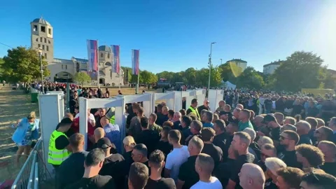 View of crowd at security checkpoint in Belgrade, Serbia. 動画素材 344861049
