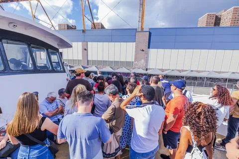 View of crowded sightseeing boat deck with tourists during New York City Photos