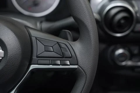View of cruise control panel on steering wheel in modern car, closeup Stock Photos